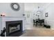 Inviting living room featuring a cozy fireplace and an adjacent dining area at 379 Villa Rosa Way, Temple, GA 30179