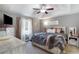 Comfortable main bedroom with tray ceiling, neutral tones, and stylish furnishings at 379 Villa Rosa Way, Temple, GA 30179