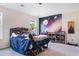 This bedroom features light grey carpet, a vaulted ceiling, and a galactic mural at 415 Paynes Lake Rd, Carrollton, GA 30116