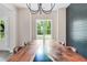 Beautiful live edge dining table illuminated by a modern chandelier, creating a bright and inviting atmosphere at 415 Paynes Lake Rd, Carrollton, GA 30116