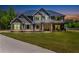 Charming two-story home with meticulously kept lawn and inviting front porch at 415 Paynes Lake Rd, Carrollton, GA 30116