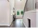 Bright foyer featuring hardwood floors, a staircase, and a view to the front doors at 415 Paynes Lake Rd, Carrollton, GA 30116