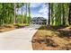 A beautiful two-story home sits far back from the street on a large, tree-filled lot at 415 Paynes Lake Rd, Carrollton, GA 30116