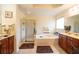 Bathroom featuring a walk-in shower, soaking tub, and dual vanity at 4734 Eagles Ridge Loop, Lithonia, GA 30038