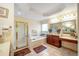 Bathroom featuring a shower, soaking tub, dual vanity and large mirror at 4734 Eagles Ridge Loop, Lithonia, GA 30038