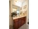 Bathroom with wood cabinets, tile flooring and bright vanity lighting at 4734 Eagles Ridge Loop, Lithonia, GA 30038