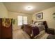 Cozy bedroom featuring a bed, window with blinds, and decorative elements at 4734 Eagles Ridge Loop, Lithonia, GA 30038