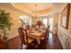 Elegant dining room with hardwood floors, tray ceiling, and large bay window at 4734 Eagles Ridge Loop, Lithonia, GA 30038