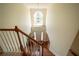Grand foyer featuring hardwood floors, a staircase, and a window above the entry door at 4734 Eagles Ridge Loop, Lithonia, GA 30038