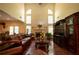 Spacious living room with high ceilings, large windows, and a fireplace at 4734 Eagles Ridge Loop, Lithonia, GA 30038