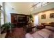 Elegant living room featuring hardwood floors, high ceilings, and a custom entertainment center at 4734 Eagles Ridge Loop, Lithonia, GA 30038