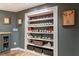 Basement display shelves filled with collectibles and décor at 745 Devon Hill Ct, Roswell, GA 30075