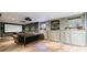Finished basement with a home theater setup and built-in cabinets for storage at 745 Devon Hill Ct, Roswell, GA 30075