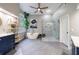 This bright bathroom has a walk-in shower, soaking tub, and stylish vanity with a grey tile floor at 745 Devon Hill Ct, Roswell, GA 30075