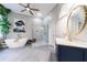 Bathroom with a walk-in shower, soaking tub, stylish vanity, and a soothing color palette at 745 Devon Hill Ct, Roswell, GA 30075