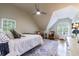 Well lit bedroom featuring windows on two walls, a ceiling fan, and hardwood flooring at 745 Devon Hill Ct, Roswell, GA 30075