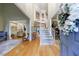 Inviting foyer with hardwood floors, high ceilings, and an elegant staircase at 745 Devon Hill Ct, Roswell, GA 30075