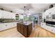 Spacious gourmet kitchen with a center island, custom cabinetry, and granite countertops at 745 Devon Hill Ct, Roswell, GA 30075