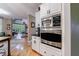 Modern kitchen with granite countertops and stainless steel appliances at 745 Devon Hill Ct, Roswell, GA 30075