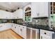 Modern kitchen with stainless steel appliances and granite counters at 745 Devon Hill Ct, Roswell, GA 30075