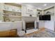 Bright living room with fireplace and custom shelves at 745 Devon Hill Ct, Roswell, GA 30075