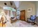 Comfortable living room with a large window, comfortable seating, and hardwood floors at 745 Devon Hill Ct, Roswell, GA 30075