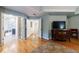 An opening off the main bedroom shows the en-suite bathroom; hardwood floors run throughout at 745 Devon Hill Ct, Roswell, GA 30075