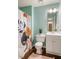 Bright bathroom with modern vanity, stylish shower curtain, and light blue walls at 45 Pine Tree Dr, Mcdonough, GA 30252