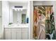 Bathroom with modern vanity, large mirror, and a unique floral shower curtain for a touch of style at 45 Pine Tree Dr, Mcdonough, GA 30252