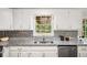 Kitchen with granite countertops, stainless steel appliances, white cabinetry, and decorative backsplash at 45 Pine Tree Dr, Mcdonough, GA 30252