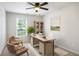 Cozy office with neutral tones, a ceiling fan, natural light, and comfortable seating at 45 Pine Tree Dr, Mcdonough, GA 30252