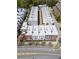 Aerial view of a well-planned community with neatly arranged townhomes and green spaces at 89 E Andrews Nw Dr, Atlanta, GA 30305