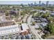 Scenic aerial view capturing a community amidst lush greenery and the city skyline in the distance at 89 E Andrews Nw Dr, Atlanta, GA 30305