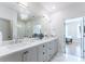 Bathroom with double sink vanity, marble floors, and glass-enclosed shower at 89 E Andrews Nw Dr, Atlanta, GA 30305