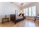 Well lit Bedroom with a full size bed and hardwood floors at 89 E Andrews Nw Dr, Atlanta, GA 30305