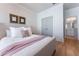 Cozy bedroom featuring hardwood floors, neutral walls, and a comfortable bed at 89 E Andrews Nw Dr, Atlanta, GA 30305