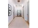 Hallway with hardwood floors, neutral rug, modern lighting, and stylish decor at 89 E Andrews Nw Dr, Atlanta, GA 30305