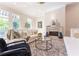 Comfortable living room featuring a decorative fireplace, lots of natural light, and neutral tones at 89 E Andrews Nw Dr, Atlanta, GA 30305