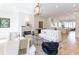 Bright and airy living room with hardwood floors, fireplace, and open floor plan to kitchen at 89 E Andrews Nw Dr, Atlanta, GA 30305
