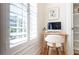 Comfortable office space with bright window, desk, chair, and built-in storage at 89 E Andrews Nw Dr, Atlanta, GA 30305