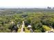 A charming house nestled within lush surroundings, complemented by views of the city skyline at 1178 Roxboro Ne Cv, Atlanta, GA 30324