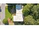 An aerial view of a house with a large yard surrounded by lush trees at 1178 Roxboro Ne Cv, Atlanta, GA 30324