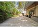 Spacious back patio offering ample room for outdoor dining and entertaining, with mature trees nearby at 1178 Roxboro Ne Cv, Atlanta, GA 30324