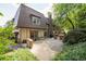 Beautiful view of backyard, featuring a large patio area and mature trees providing shade and privacy at 1178 Roxboro Ne Cv, Atlanta, GA 30324