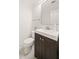A bathroom with a dark wood vanity and modern lighting at 1178 Roxboro Ne Cv, Atlanta, GA 30324