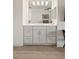 Bathroom featuring vanity with double sinks and decorative accents at 1178 Roxboro Ne Cv, Atlanta, GA 30324