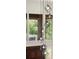 Geometric chandelier with views of brick exterior and window at 1178 Roxboro Ne Cv, Atlanta, GA 30324