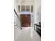 Bright foyer featuring tile floors, modern light fixture and staircase at 1178 Roxboro Ne Cv, Atlanta, GA 30324