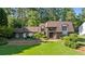 Charming home featuring a large front lawn and mature landscaping at 1178 Roxboro Ne Cv, Atlanta, GA 30324