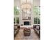Cozy living room features fireplace and chandelier at 1178 Roxboro Ne Cv, Atlanta, GA 30324